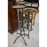 A set of three wrought iron plant stands