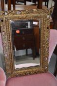 A late 19th/early 20th Century gilt framed wall mirror, approx. 62 x 40cm