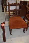 A Victorian mahogany bedroom/nursing chair , having low dralon seat on turned legs and front
