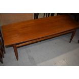 A vintage teak coffee table, approx. 129 x 52cm