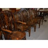 A set of five (four plus one) wheelback kitchen chairs