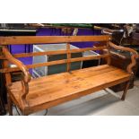 A large hardwood bench with brass and iron fixings , of Indian origin, quite possibly from railways,