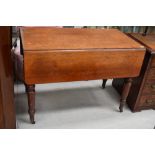 A Victorian mahogany drop leaf dining table, on turned legs and brass casters, width approx 107cm