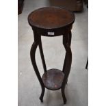 An early 20th Century oak plant stand, height approx. 94cm