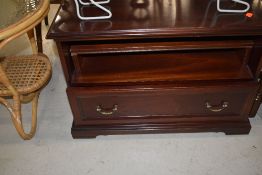 A mahogany effect low TV cabinet, approx. width 68cm