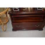 A mahogany effect low TV cabinet, approx. width 68cm