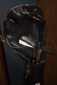 A selection of vintage golf clubs in bag