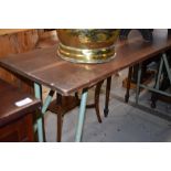 A vintage metal framed folding work table, approx 120cm x 38cm
