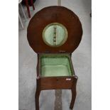 An early to mid 20th Century oak sewing table, having lift lid, approx. width 50cm