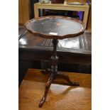 A reproduction wine table, leather inset top on triple splay legs, approx. width 33cm height 50cm