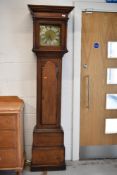 An18th Century and later oak longcase clock, having 8 day movement, 25cm brass and silvered dial,