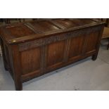 A period oak kist/coffer, having panelled sides, with carved frieze, LTA 1689, lock mechanism