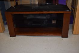 A modern TV stand, mahogany and smoked glass, width approx. 100cm