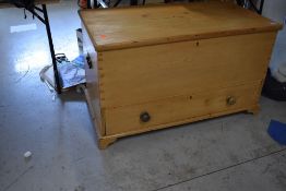 A stripped pine blanket box, having lower drawer section, approx. Dimensions W112cm D57cm H65cm