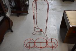 A vintage wirework stand, possibly dairy related, branding to top 'Happymaid'