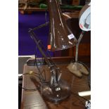 A vintage Herbert Terry style angle poise desk lamp on cast base, labelled for BHS