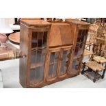 An early 20th Century golden oak side by side bureau display cabinet