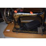 A traditional hand crank sewing machine by Singer