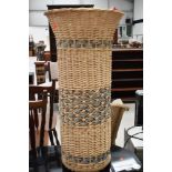 A tall basket of fabrics