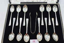 A cased set of twelve silver teaspoons with matching pair of sugar nips of plain form having stepped
