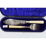 A cased set of Victorian silver fish servers having engraved fish and flowers to blade, Sheffield
