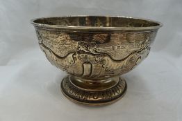 A Victorian silver rose bowl having repousse scroll decoration, rub over rim and circular pedestal