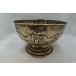 A Victorian silver rose bowl having repousse scroll decoration, rub over rim and circular pedestal