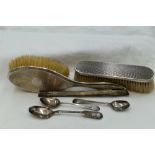 A small selection of HM silver including brushes with engine turned chequered decoration,