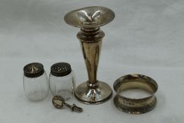 A small selection of HM silver including napkin ring, bud vase, pepperettes and a napkin clip