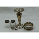 A small selection of HM silver including napkin ring, bud vase, pepperettes and a napkin clip