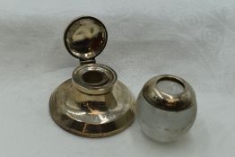 A silver capstan ink well of traditional form having clear glass liner, Birmingham 1925, S & Co, and