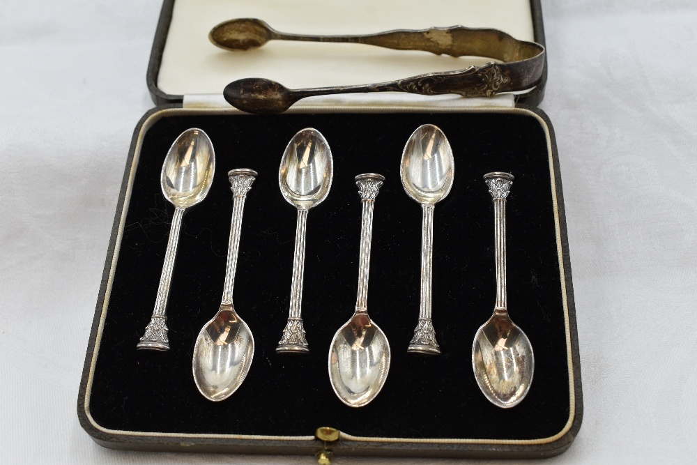 A cased set of six silver coffee spoons having terminals in the form of Corinthian columns, London