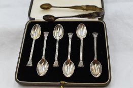 A cased set of six silver coffee spoons having terminals in the form of Corinthian columns, London