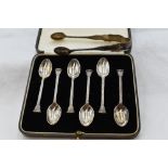 A cased set of six silver coffee spoons having terminals in the form of Corinthian columns, London