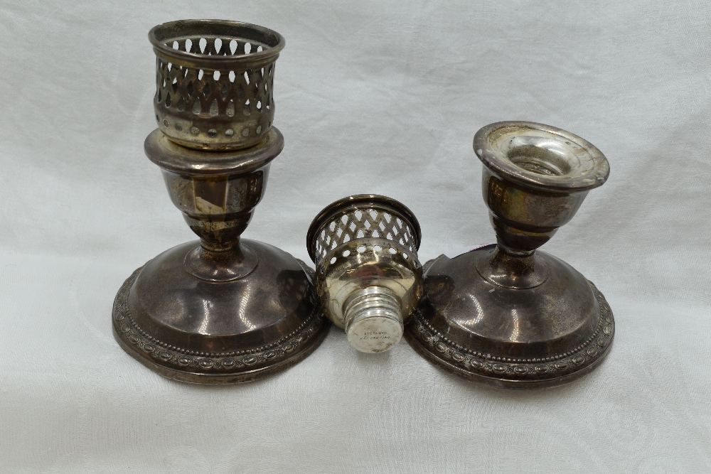 A pair of American silver candle sticks of squat form by La Pierre of New York having screw in