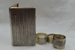 A white metal cigarette case stamped sterling silver of rectangular form having striped decoration