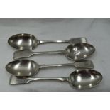 Four Edwardian silver table spoons of fiddle back form bearing monogram M to terminals, London