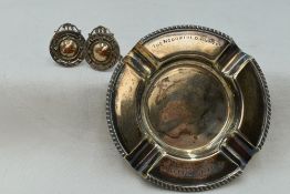 A silver ashtray of traditional circular form inscribed The Woodfield Plate UB golf club 1954,