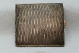 A silver cigarette case having engine turned chequered decoration, Birmingham 1927, D Bros, approx