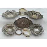 A selection of HM silver including an oval pin tray with moulded lovers scene, a pair of oval pin