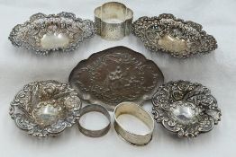 A selection of HM silver including an oval pin tray with moulded lovers scene, a pair of oval pin