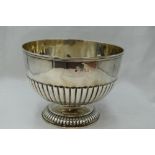 A Victorian silver rose bowl having rub over rim, gadrooned decoration and pedestal foot, London