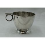 A silver Christening cup of plain form inscribed Michael having circular loop handle with thumb rest