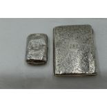 A Victorian silver aide memoire purse having engraved scroll decoration and monogrammed cartouche