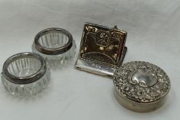 Two cut glass salts having HM silver collars, a white metal circular trinket box stamped sterling