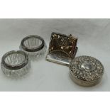 Two cut glass salts having HM silver collars, a white metal circular trinket box stamped sterling