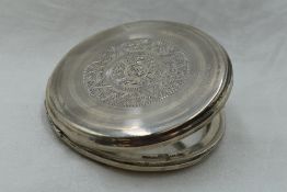 A white metal mirrored compact stamped Sterling having Aztec style engraved decoration to lid and