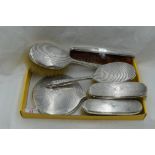 A six piece silver dressing table set having engine turned decoration and bearing monogram B to