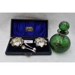 A cased pair of Victorian silver salts having frilled rims and matched white metal spoons,