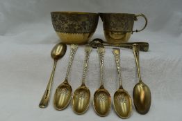 A Victorian silver gilt cream jug, sugar bowl, six coffee spoons and sugar nips all having